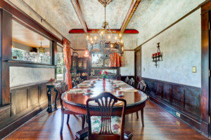 Long round wooden table with chandelier